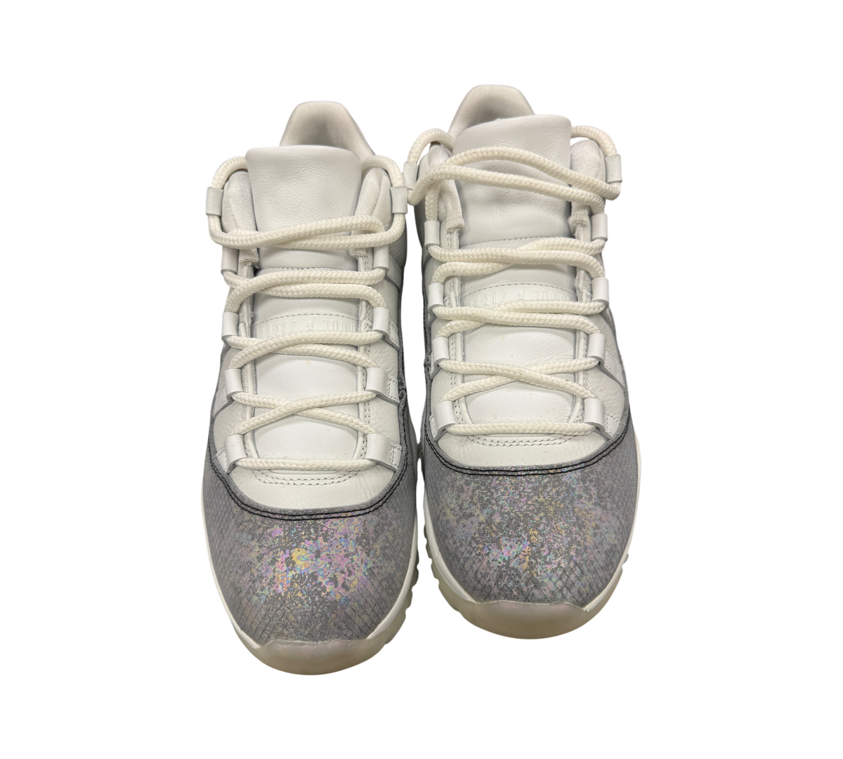 Genesis Boutique Jordan 11 Low Year of the Snake sneakers featuring white leather uppers and iridescent snake-print mudguards