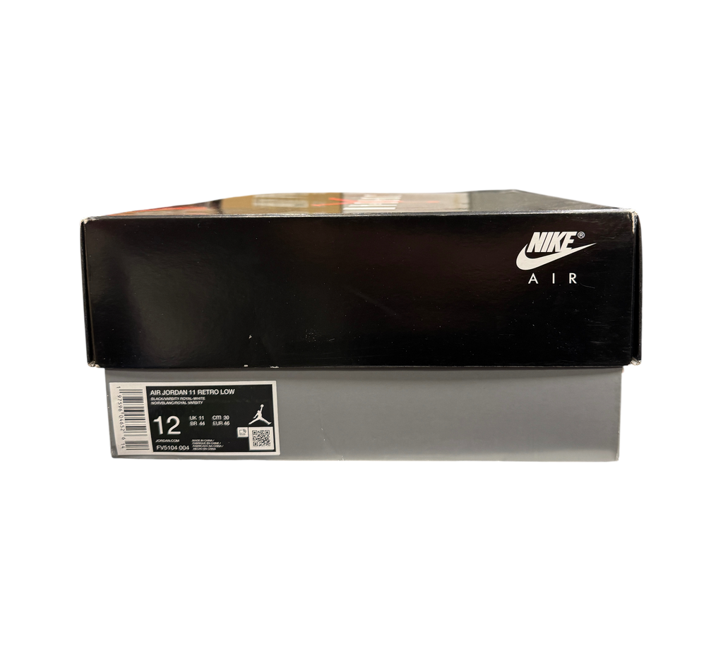 Genesis Boutique Jordan 11 Low Space Jam sneaker box with Nike Air branding on a retail shelf