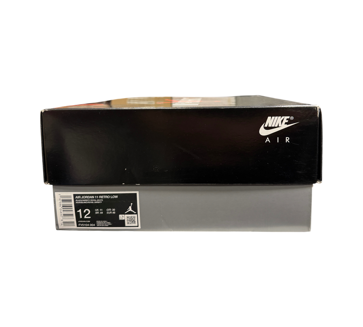 Genesis Boutique Jordan 11 Low Space Jam sneaker box with Nike Air branding on a retail shelf