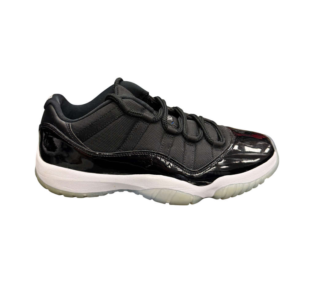 Genesis Boutique Jordan 11 Low Space Jam sneakers in black mesh and patent leather with a white midsole and icy sole.