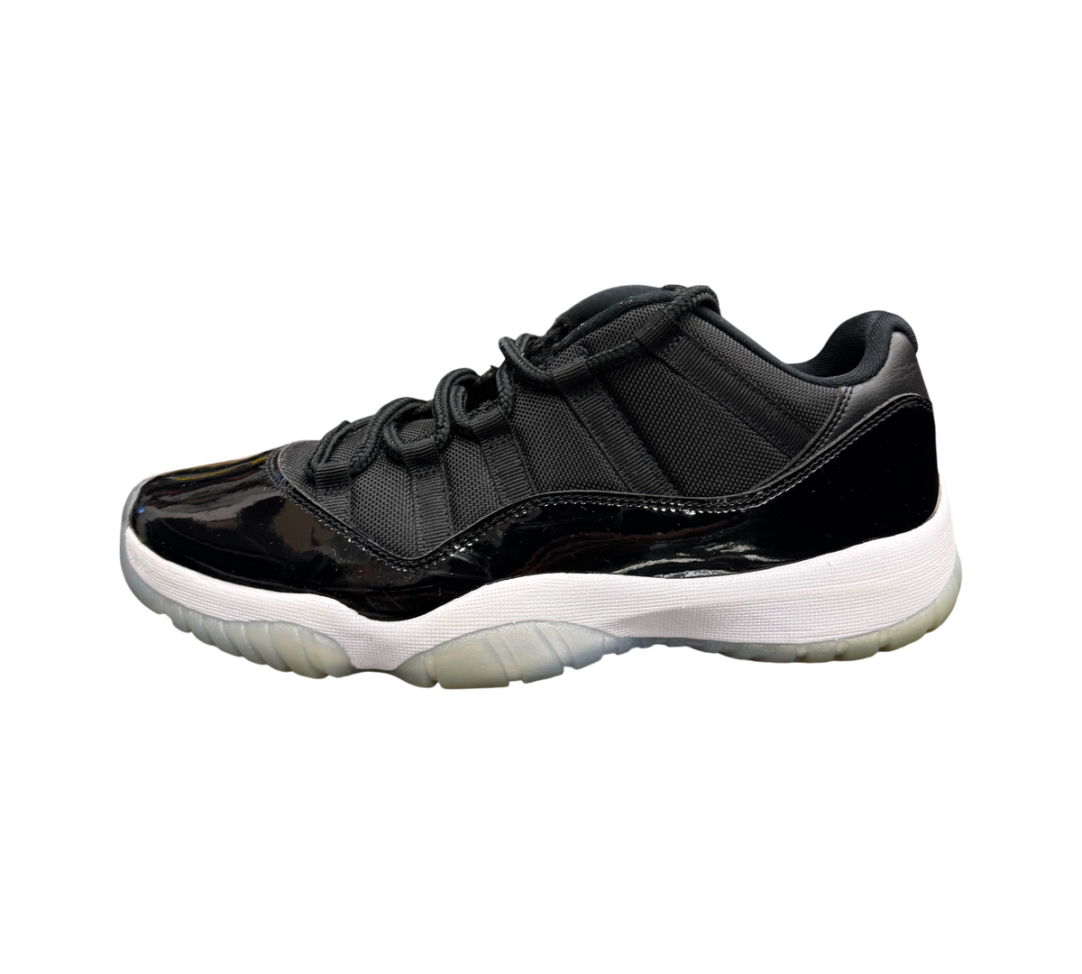 Genesis Boutique Jordan 11 Low Space Jam sneakers in black with patent leather and translucent outsole.