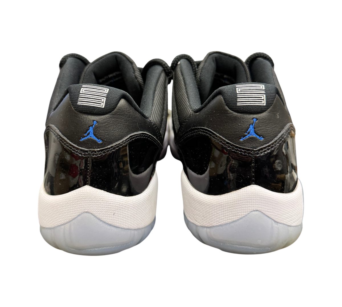 Genesis Boutique Jordan 11 Low Space Jam sneakers featuring black patent leather heels and blue Jumpman logos