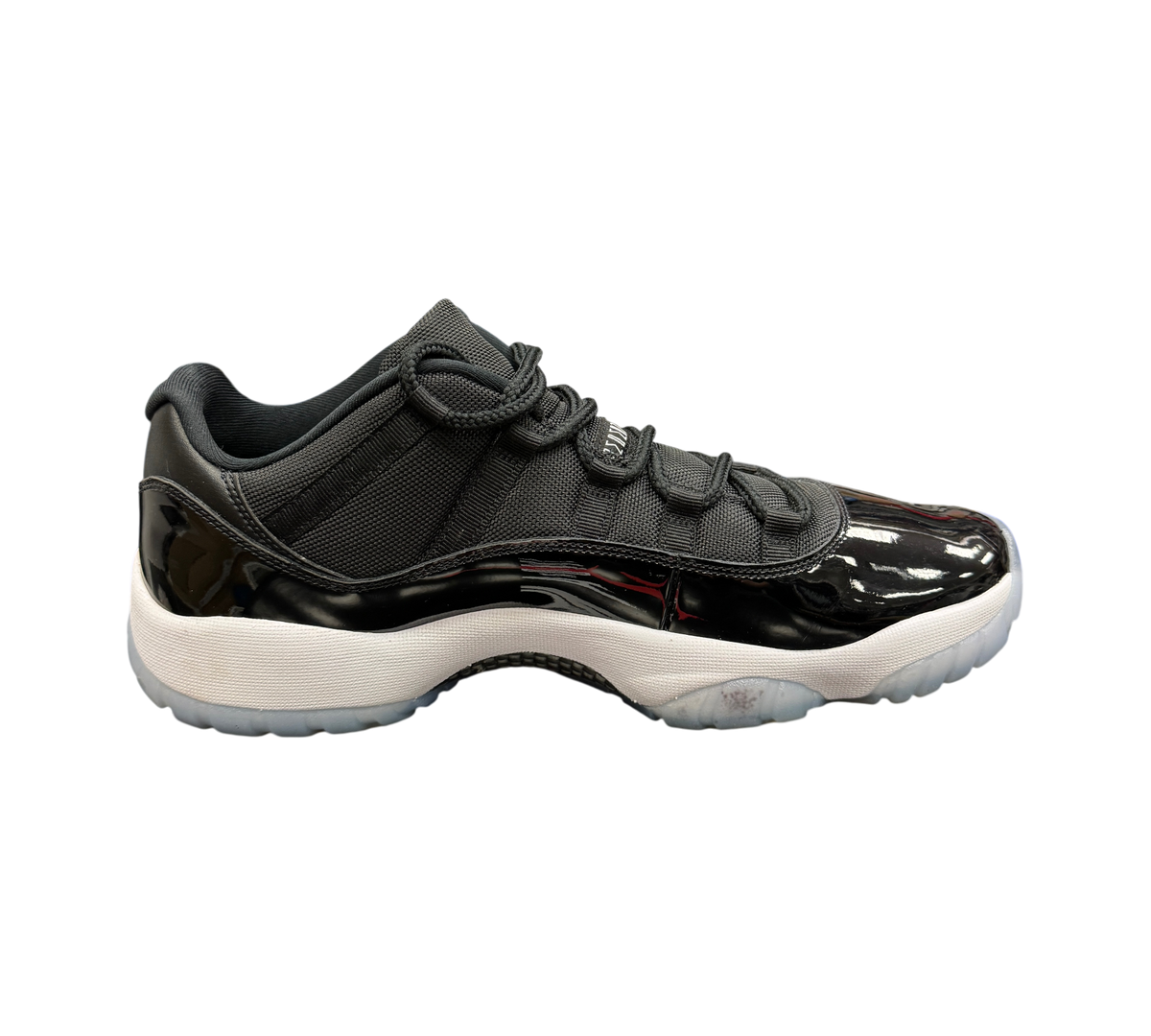Genesis Boutique Jordan 11 Low Space Jam sneakers in black patent leather and mesh with a white midsole