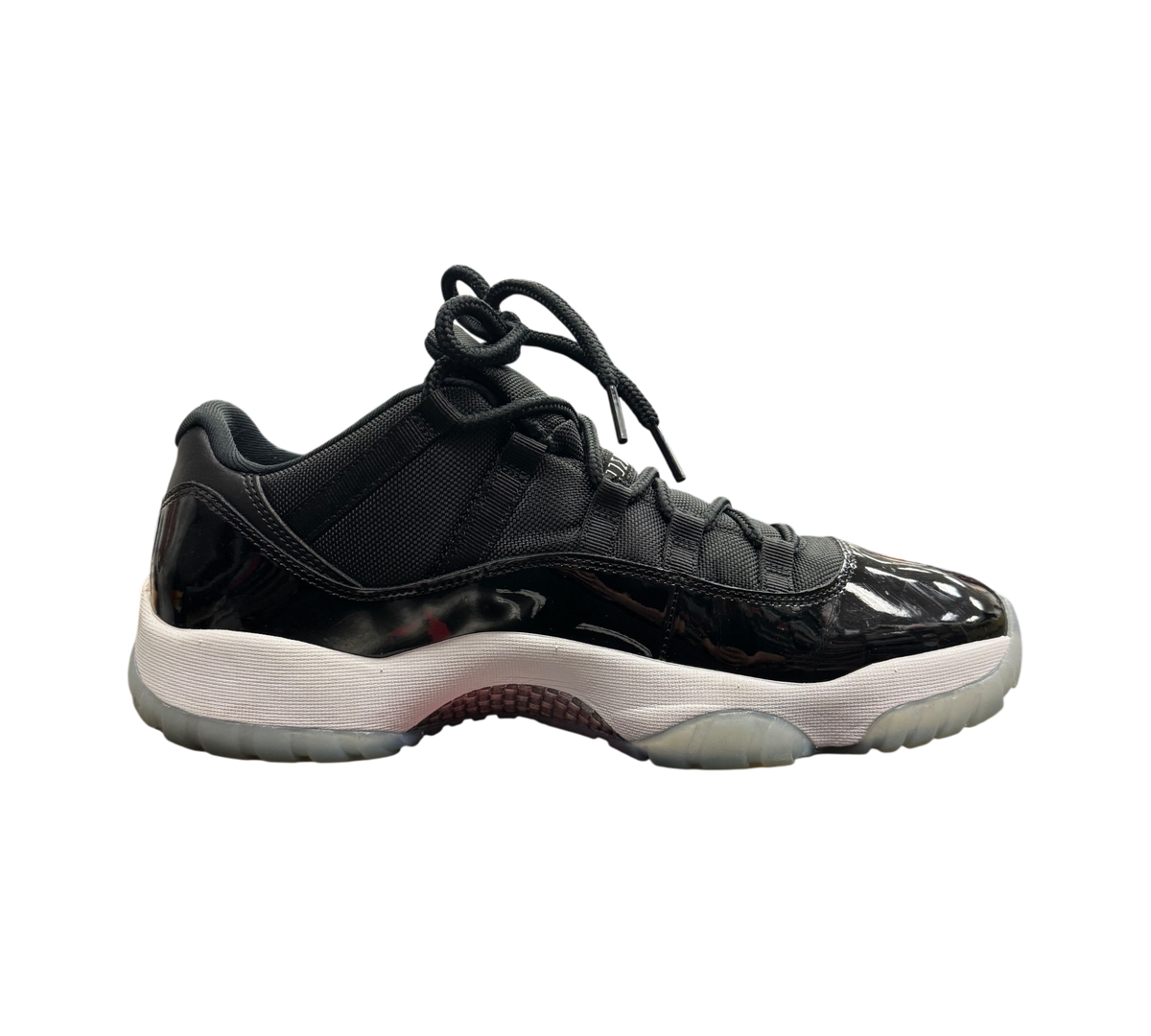 Genesis Boutique Jordan 11 Low Space Jam sneakers in black patent leather with a white midsole and icy translucent sole