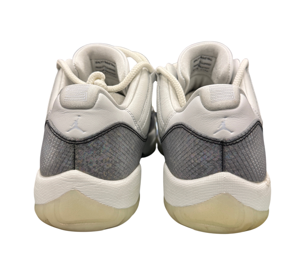 Genesis Boutique Jordan 11 Low Year of the Snake sneakers showing the white leather heels and grey snakeskin pattern
