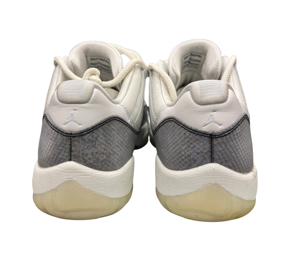 Genesis Boutique Jordan 11 Low Year of the Snake sneakers showing the white leather heels and grey snakeskin pattern