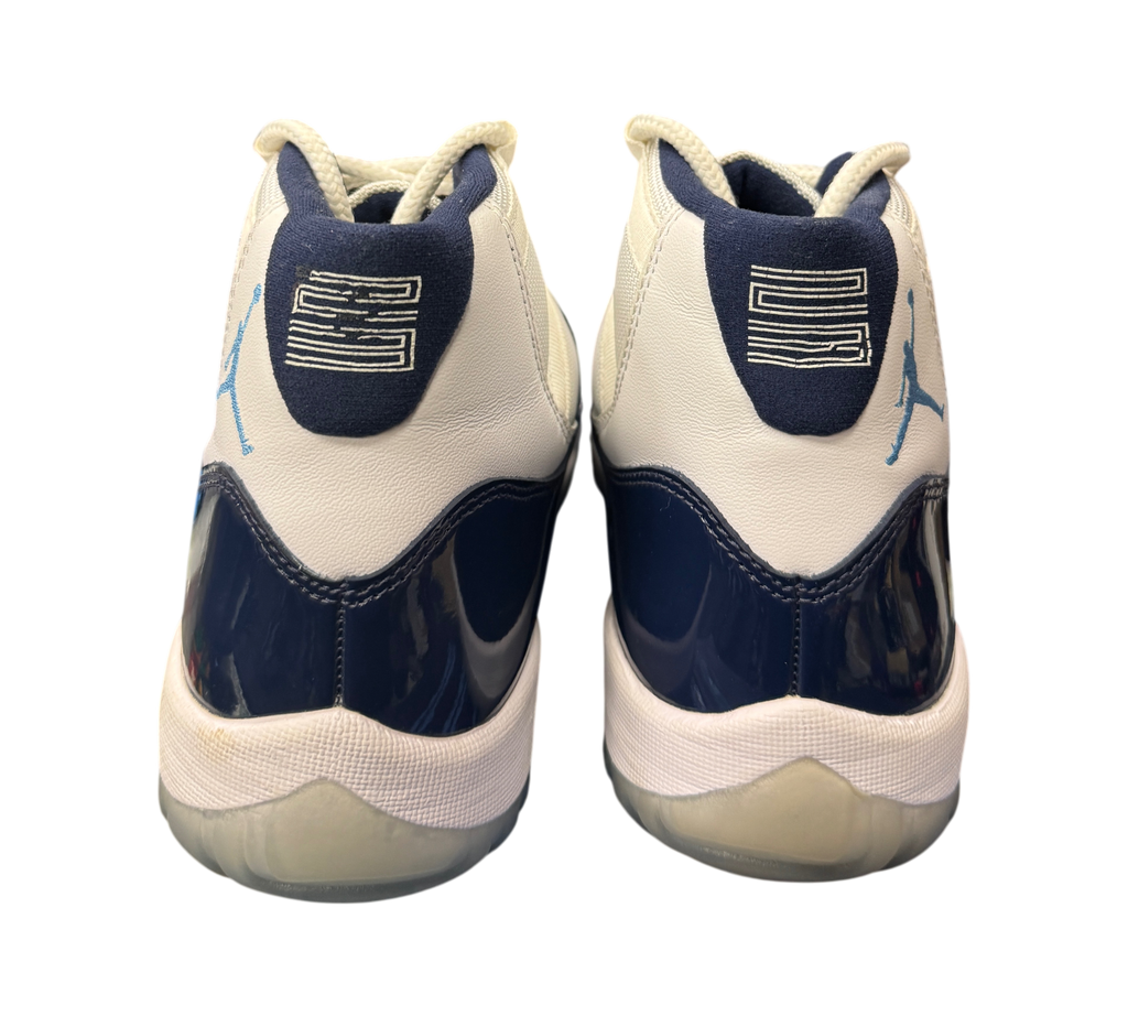 Genesis Boutique Jordan 11 Win Like 82 sneakers showing the white and navy heel view with number 23 branding