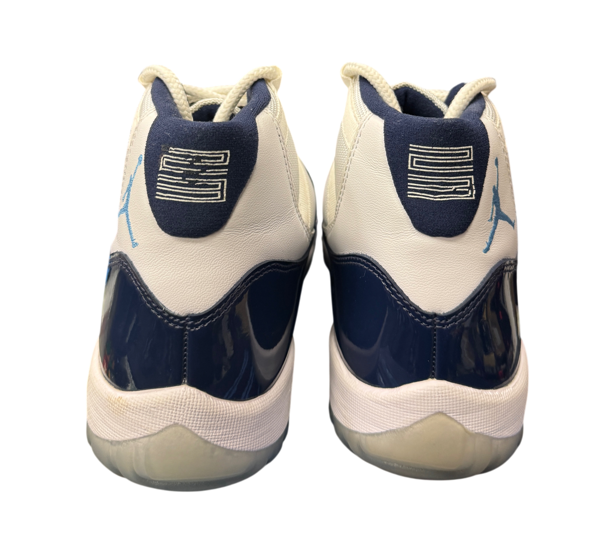 Genesis Boutique Jordan 11 Win Like 82 sneakers showing the white and navy heel view with number 23 branding