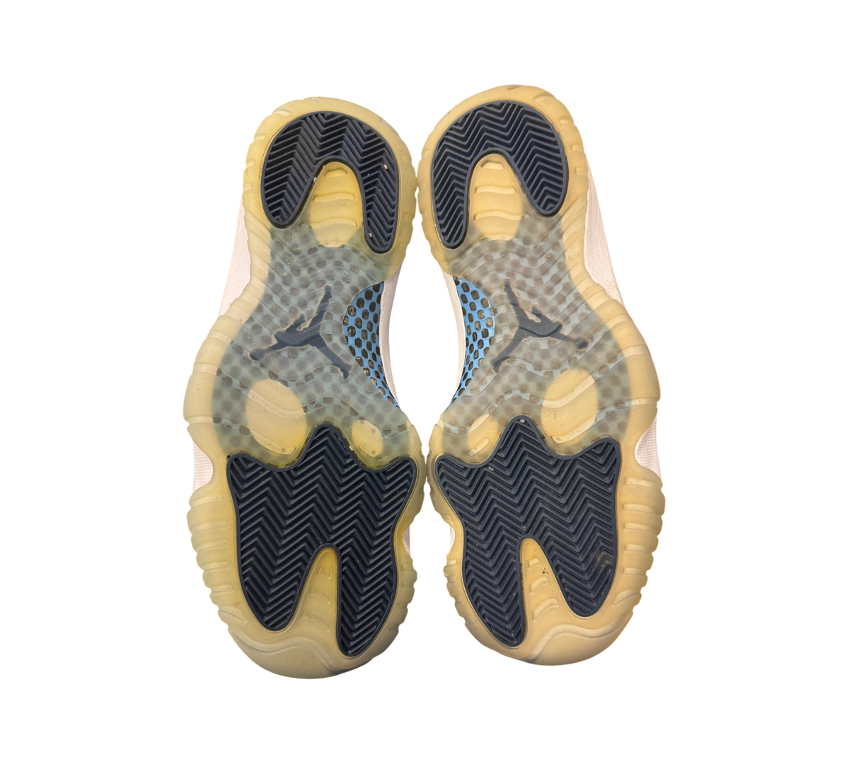 Genesis Boutique used Jordan 11 Win Like 82 sneakers showing the translucent and navy blue rubber outsoles