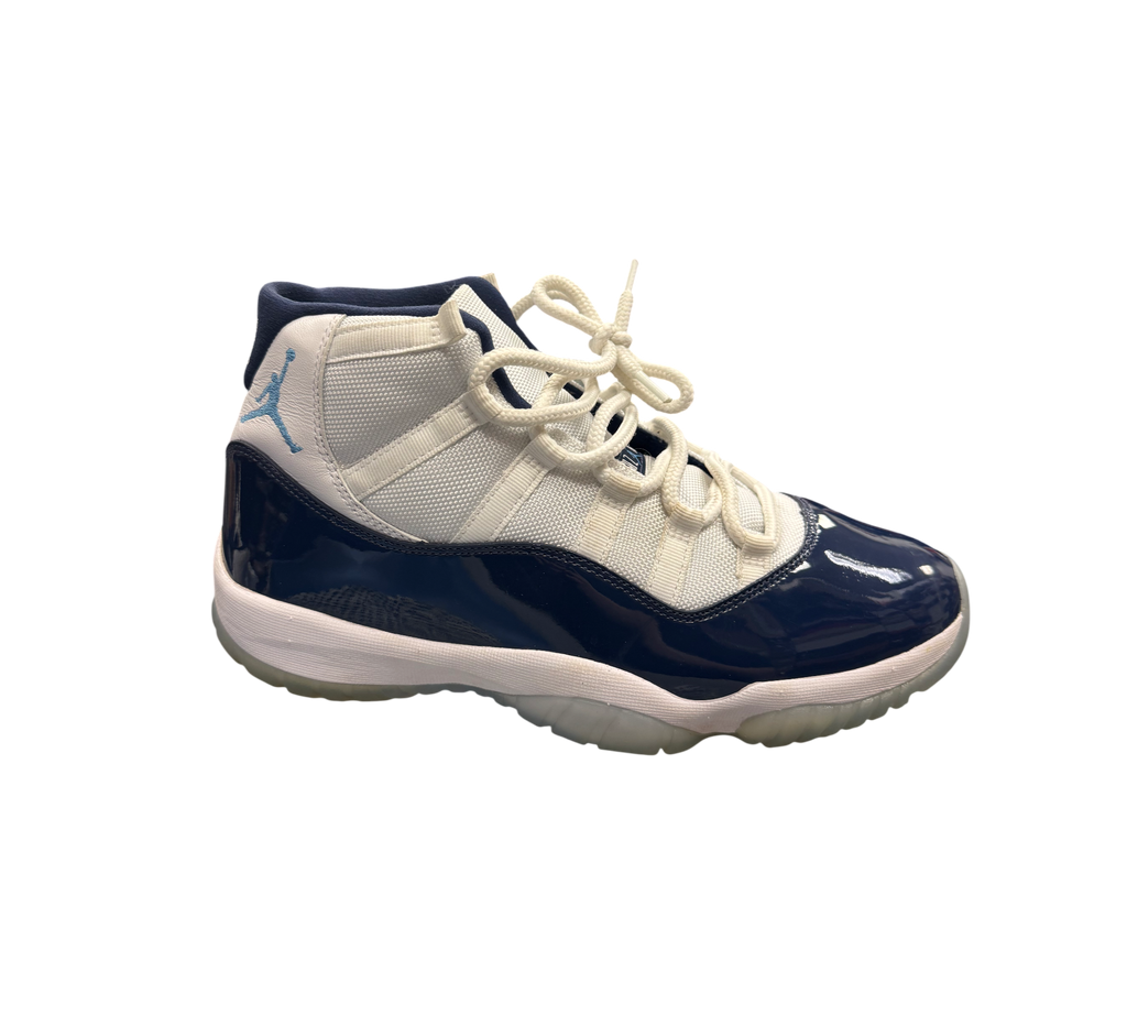 Genesis Boutique Jordan 11 "Win Like 82" shoes with white mesh and navy patent leather.