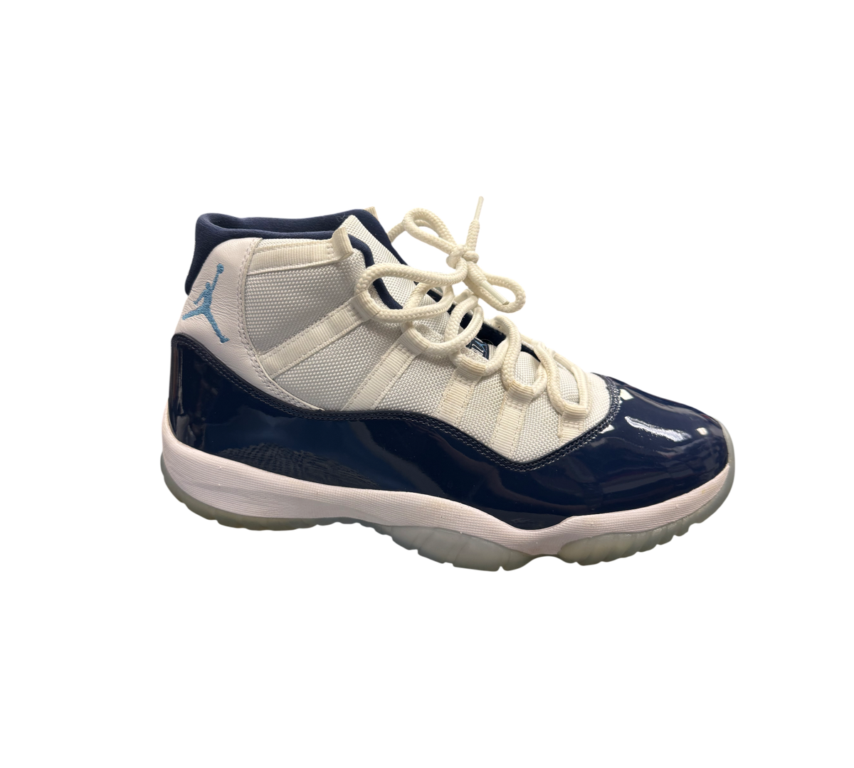 Genesis Boutique Jordan 11 "Win Like 82" shoes with white mesh and navy patent leather.