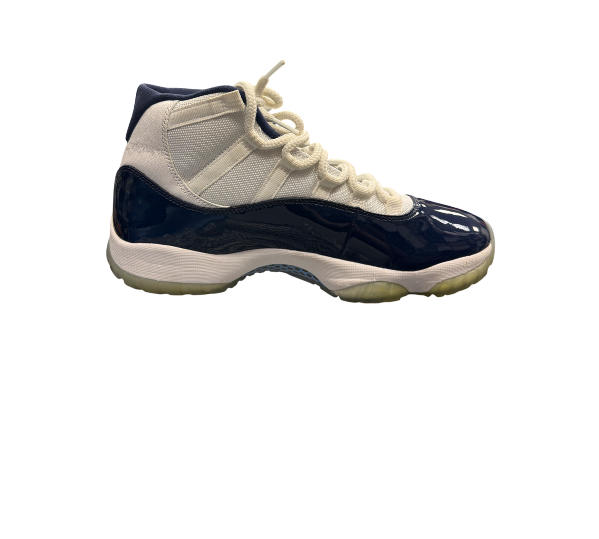 Genesis Boutique Jordan 11 "Win Like 82" sneakers in white and navy patent leather with icy blue soles.