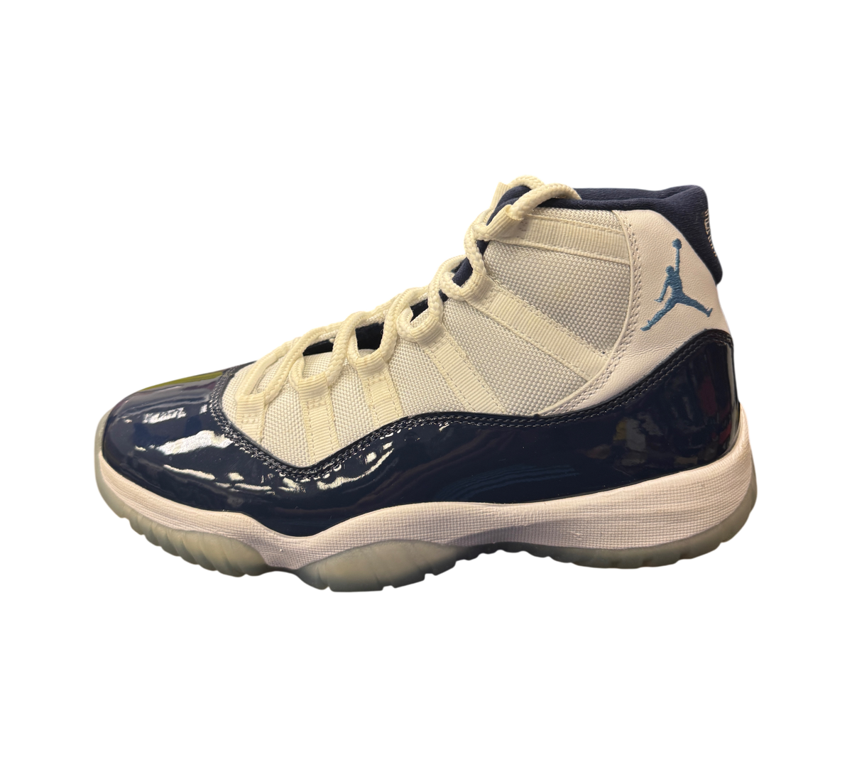 Genesis Boutique Jordan 11 Win Like 82 sneakers featuring white mesh, navy patent leather, and light blue Jumpman logo.