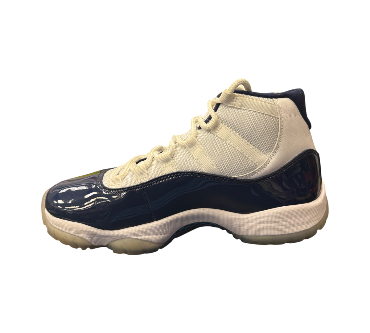 Genesis Boutique Jordan 11 Win Like 82 sneakers featuring white mesh upper and navy blue patent leather mudguard