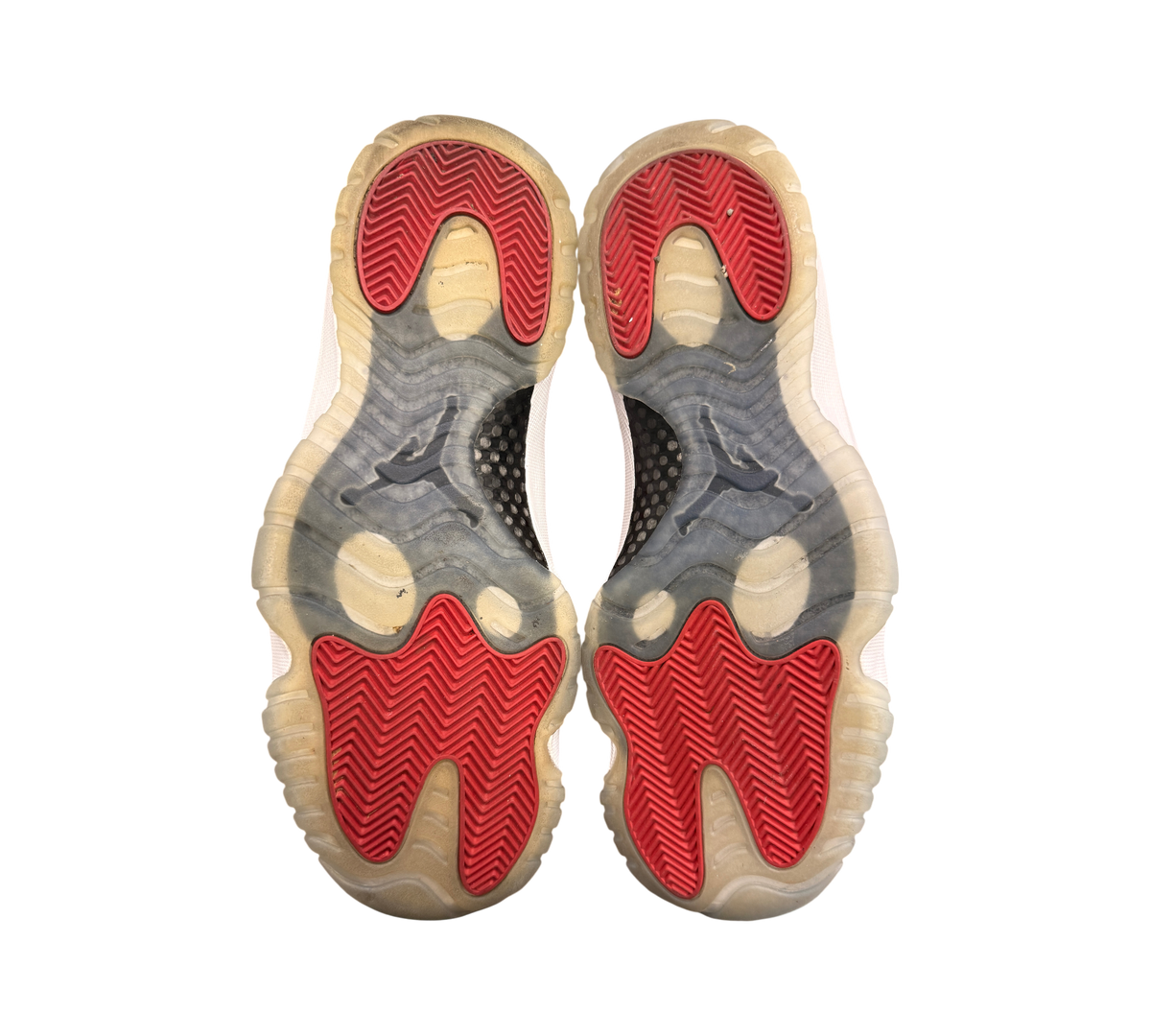 Genesis Boutique used Jordan 11 Win Like 96 sneakers showing red herringbone outsoles and yellowed translucent soles
