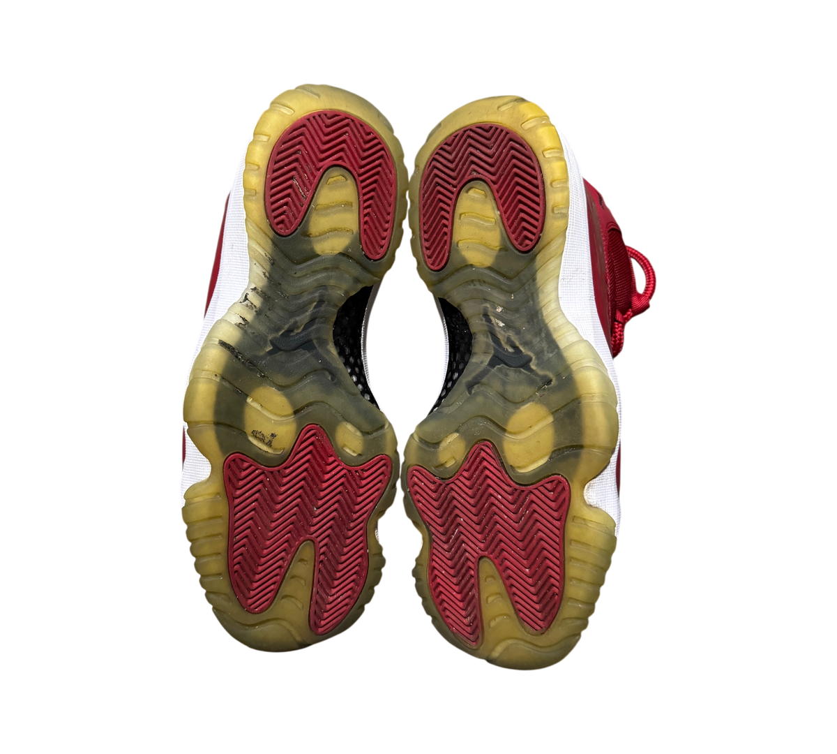 Genesis Boutique used Jordan 11 Win Like 96 sneakers showing red and translucent yellowed outsoles from below