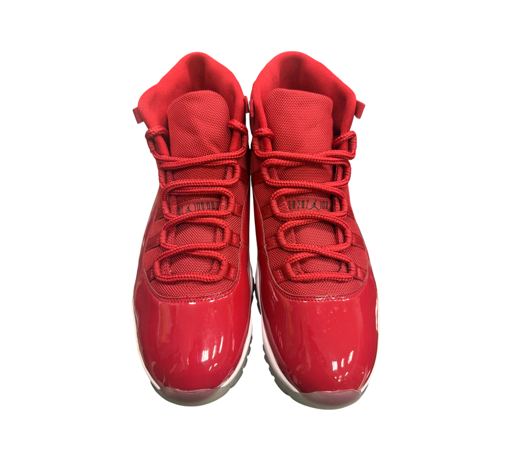 Genesis Boutique pre-owned Jordan 11 Win Like 96 sneakers in red with patent leather and slightly yellowed soles.