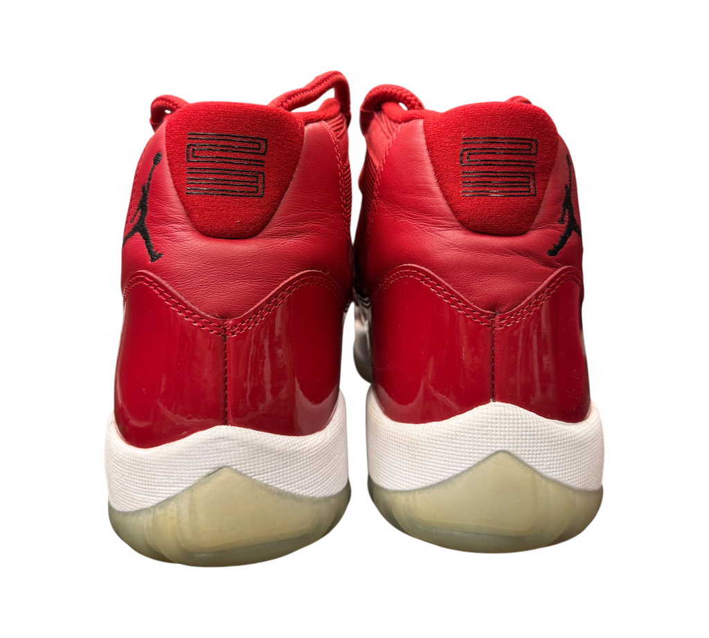Genesis Boutique Jordan 11 Win Like 96 sneakers in red patent leather with white midsoles and black 23 heel detail