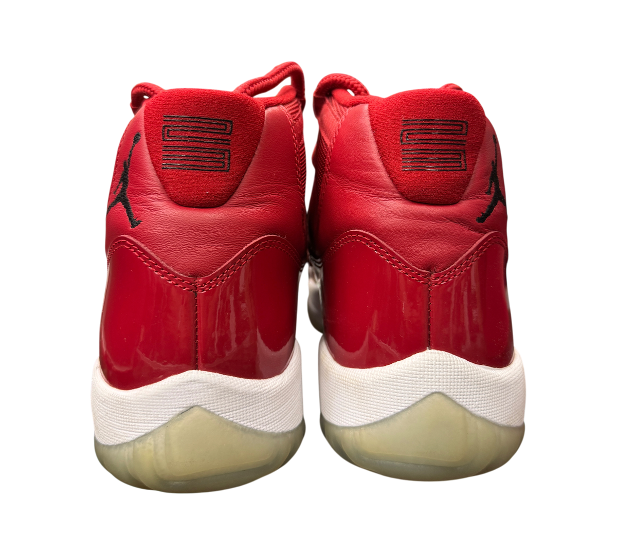Genesis Boutique Jordan 11 Win Like 96 sneakers in red patent leather with white midsoles and black 23 heel detail