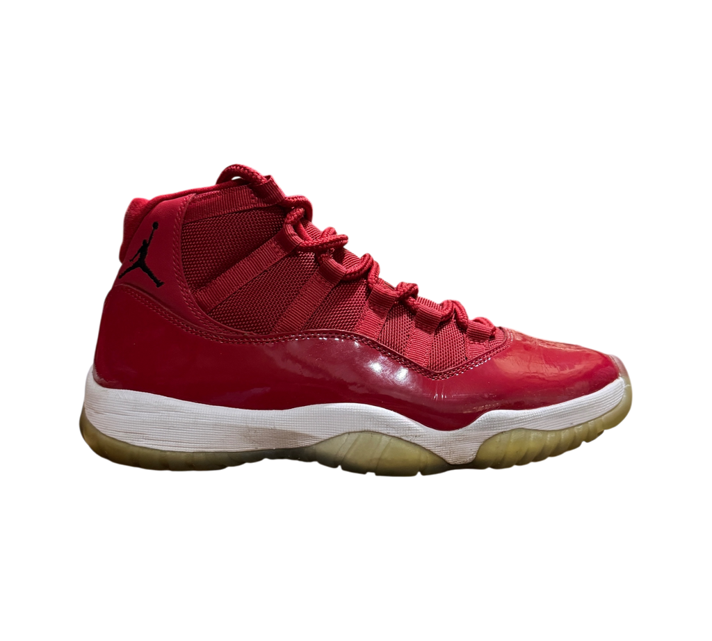 Genesis Boutique used Jordan 11 Win Like 96 sneakers in red patent leather with a white midsole and translucent sole.