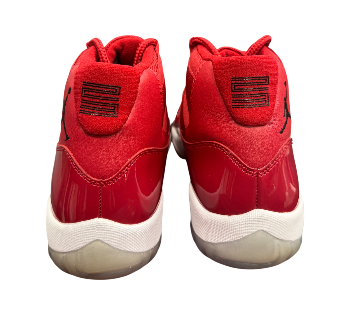 Genesis Boutique Jordan 11 Win Like 96 sneakers in red patent leather with white midsoles and black heel branding