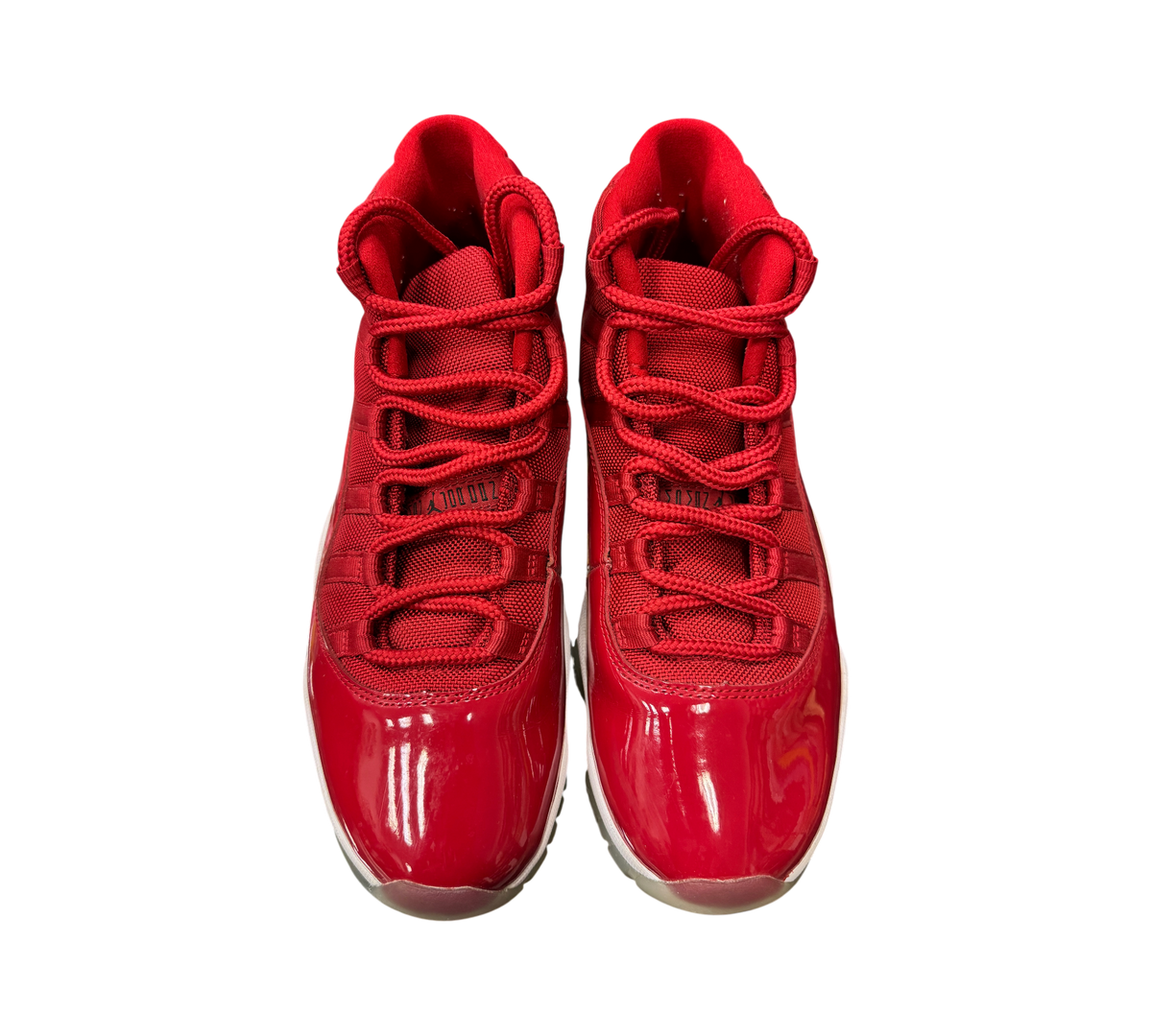 Genesis Boutique Jordan 11 Win Like 96 sneakers in gym red with patent leather mudguards and matching red laces