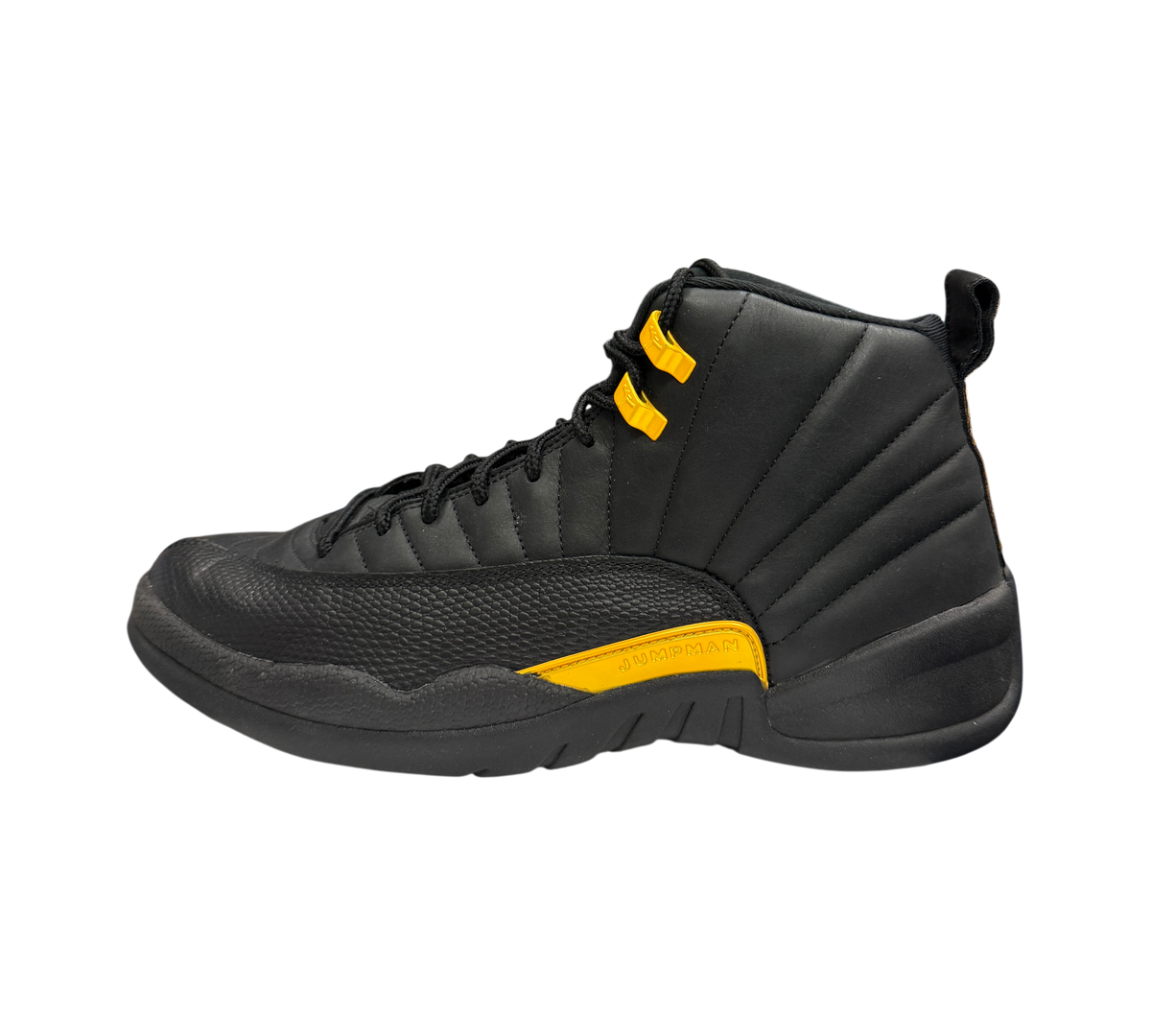 Genesis Boutique Jordan 12 Black Taxi sneakers in black leather with yellow eyelets and midsole detail