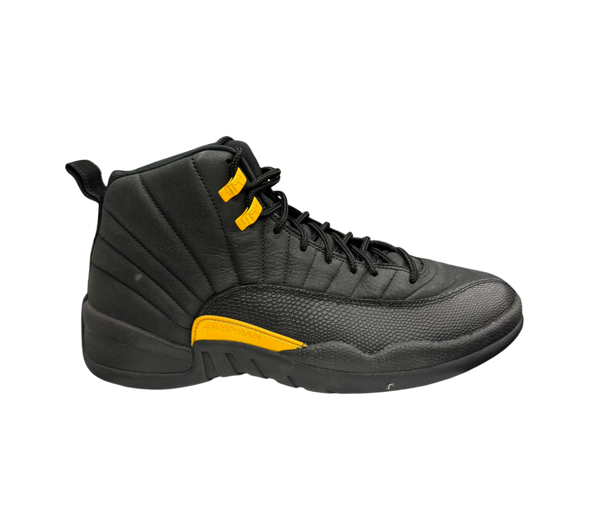 Genesis Boutique Jordan 12 Black Taxi sneaker in black leather with yellow eyelets and midsole detail