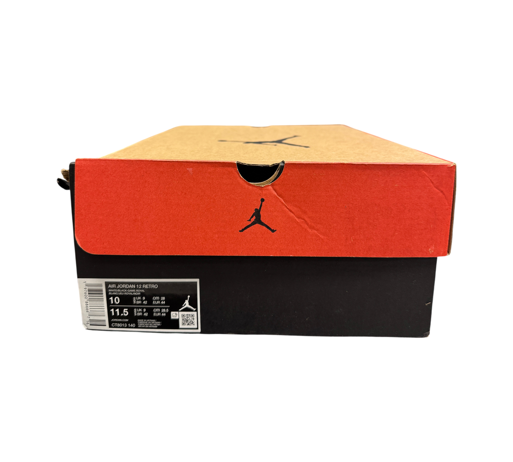 Genesis Boutique Jordan 12 Blueberry sneaker box with size label showing CT8013-140 in a retail store setting.
