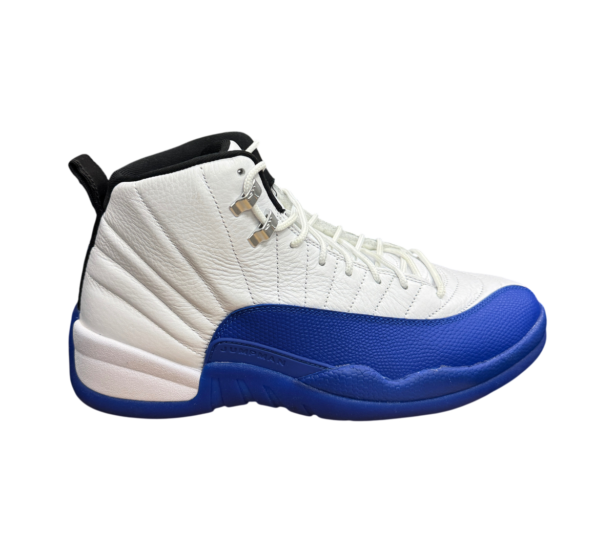 Genesis Boutique used Jordan 12 Blueberry sneakers featuring white leather and blue textured mudguard on a shoe box.