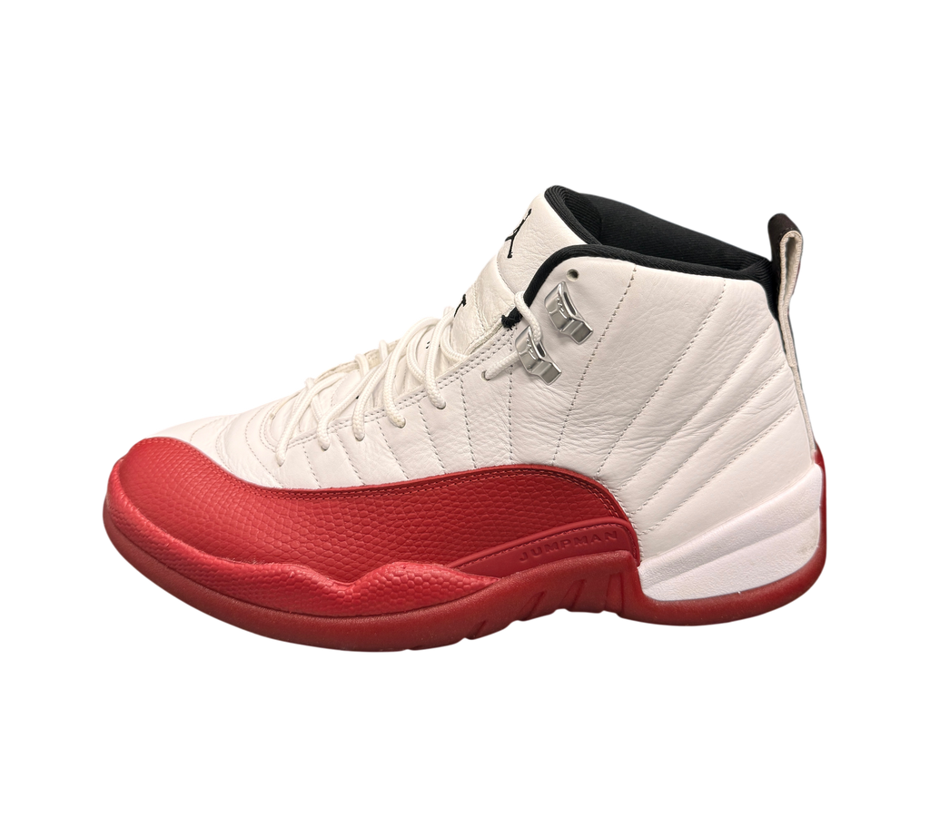 Genesis Boutique Jordan 12 Cherry sneakers featuring white leather upper with red textured mudguard and silver eyelets.