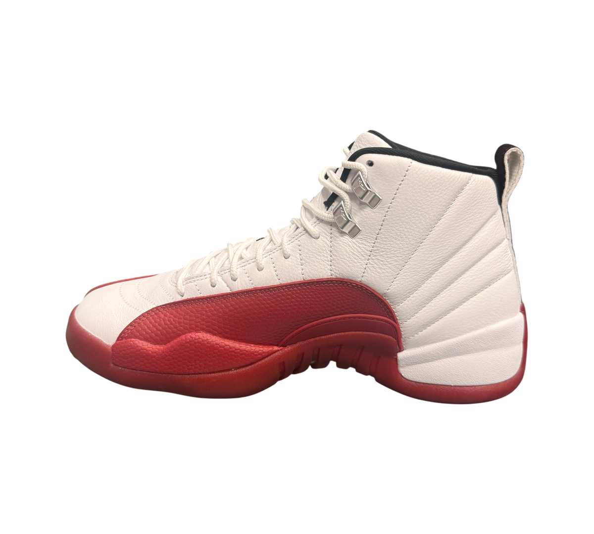 Genesis Boutique Jordan 12 "Cherry 2023" sneakers with white leather upper and red mudguard.
