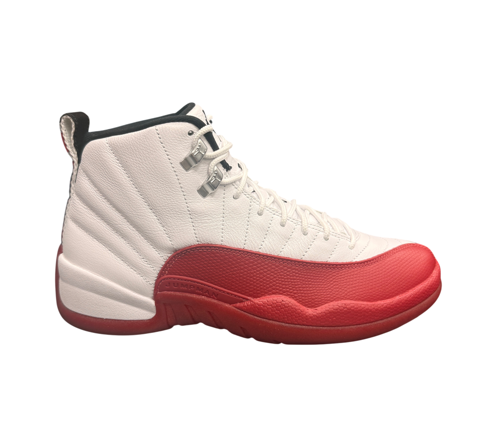 Genesis Boutique white and red leather Jordan 12 "Cherry 2023" sneakers with silver eyelets and Jumpman logo.