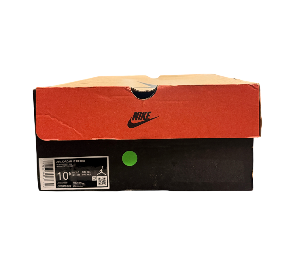 Genesis Boutique Jordan 12 Flu Game sneaker box with Nike branding and size label in a retail store setting
