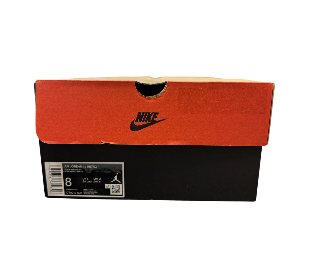 Genesis Boutique Jordan 12 Flu Game 2025 shoe box with Nike branding and size label in a retail store setting