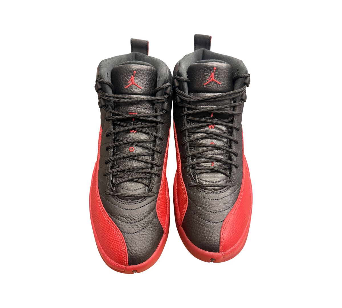 Genesis Boutique pre-owned Jordan 12 Flu Game sneakers in black and red leather with iconic Jumpman branding.