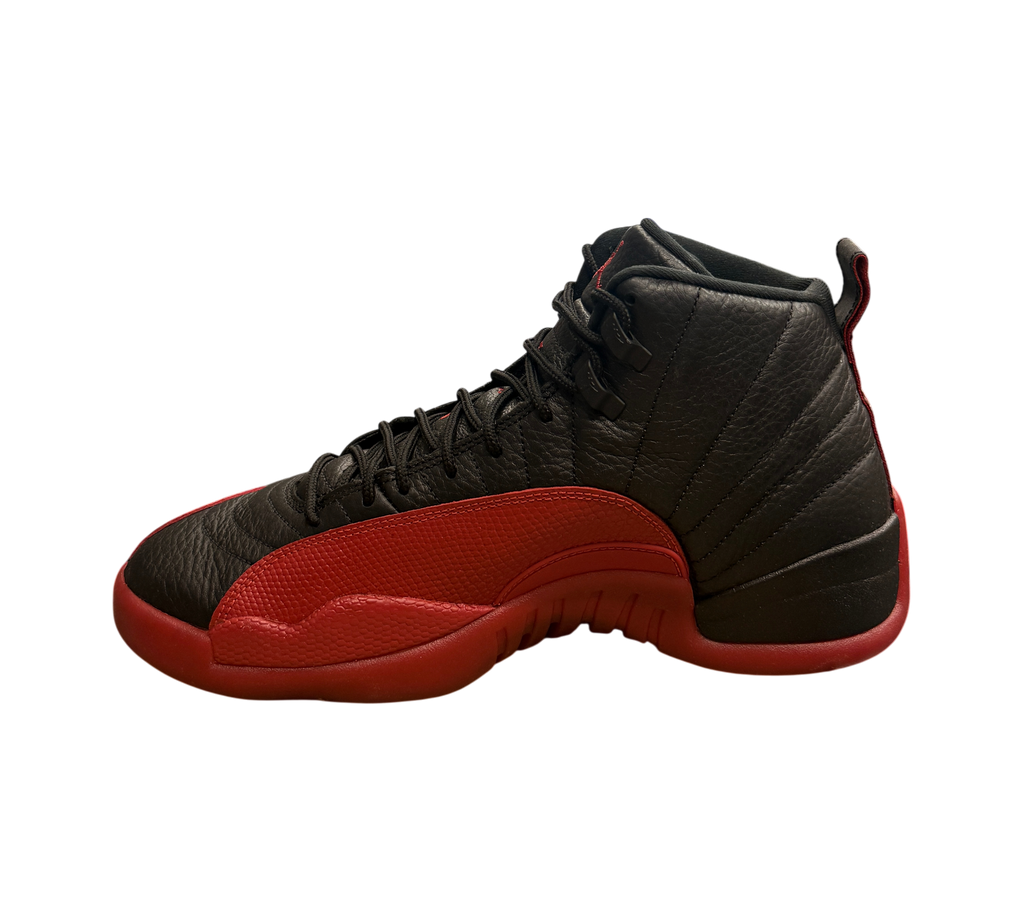 Genesis Boutique pre-owned Jordan 12 Flu Game sneakers in black and varsity red leather on a Nike shoebox.