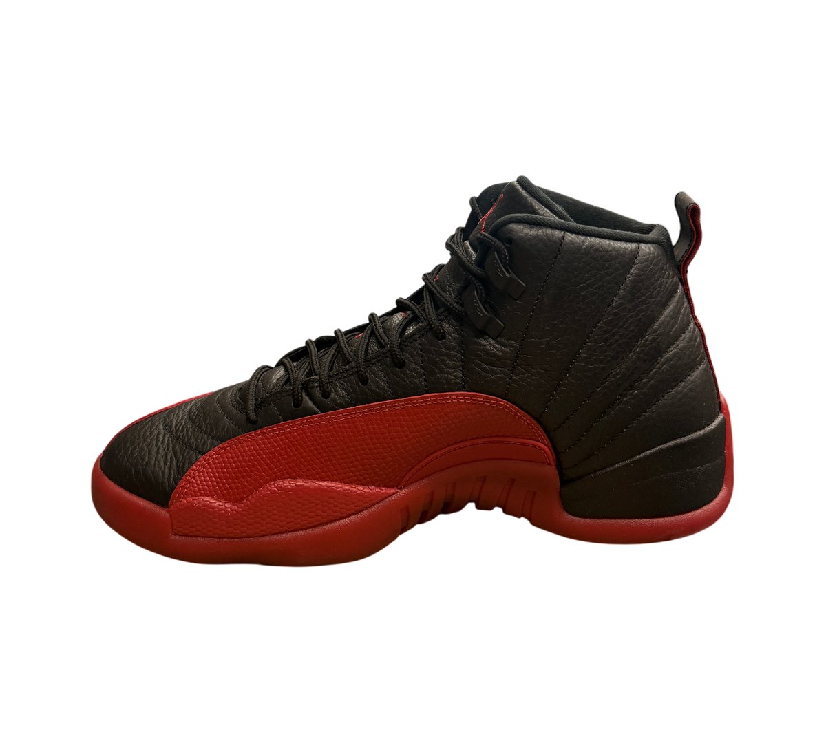Genesis Boutique pre-owned Jordan 12 Flu Game sneakers in black and varsity red leather on a Nike shoebox.