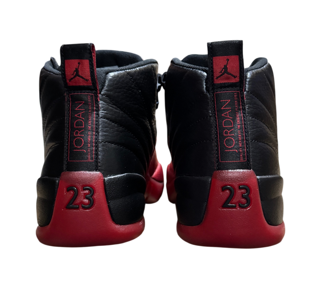 Genesis Boutique Jordan 12 Flu Game sneakers in black and red leather, rear view showing 23 branding and heel tabs