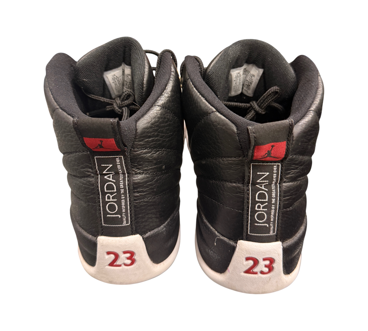 Genesis Boutique pre-owned Jordan 12 Playoff sneakers in black and white leather with red 23 branding on the heel.