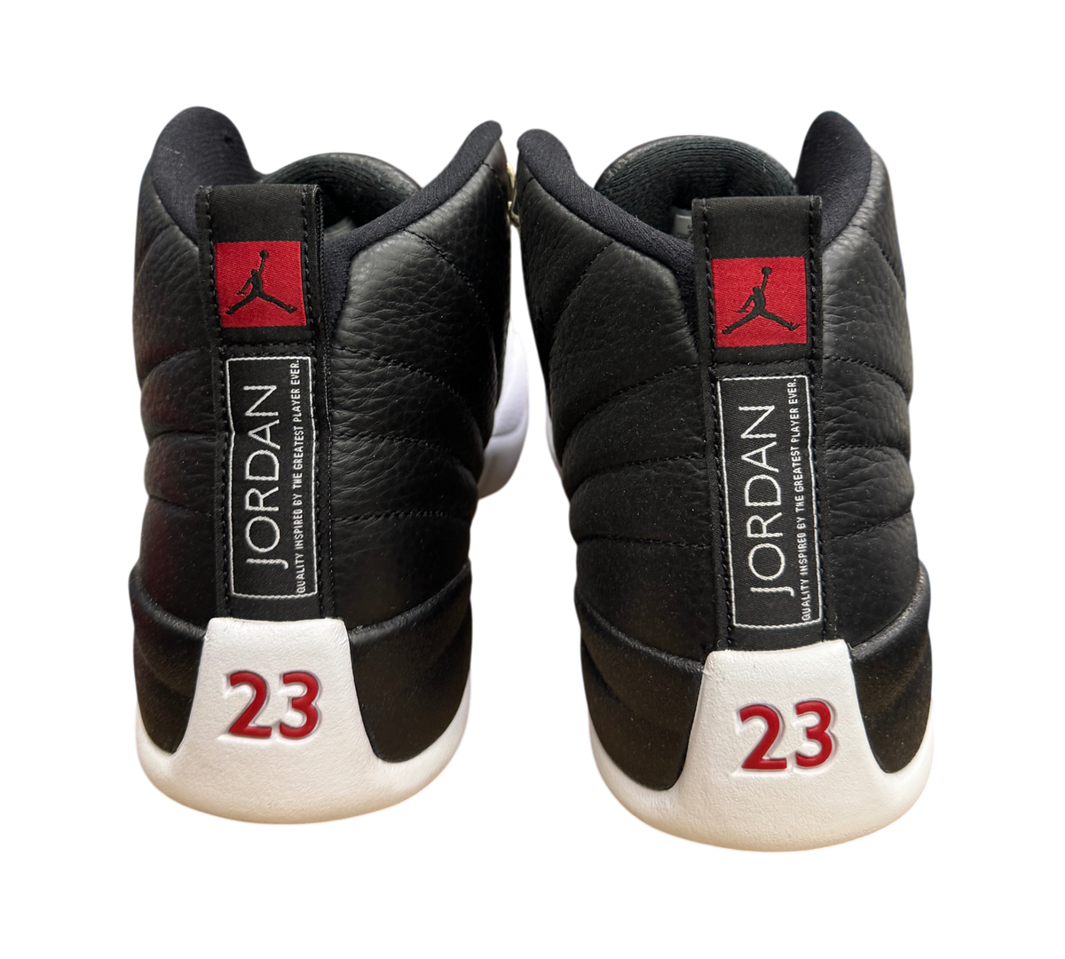 Genesis Boutique used Jordan 12 Playoff sneakers showing black leather heels with red 23 and Jumpman branding