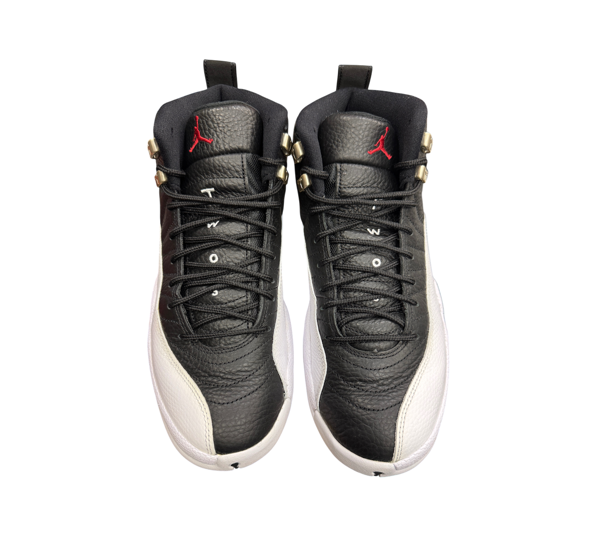 Genesis Boutique Jordan 12 Playoff sneakers in black and white leather with red Jumpman logo on the tongue