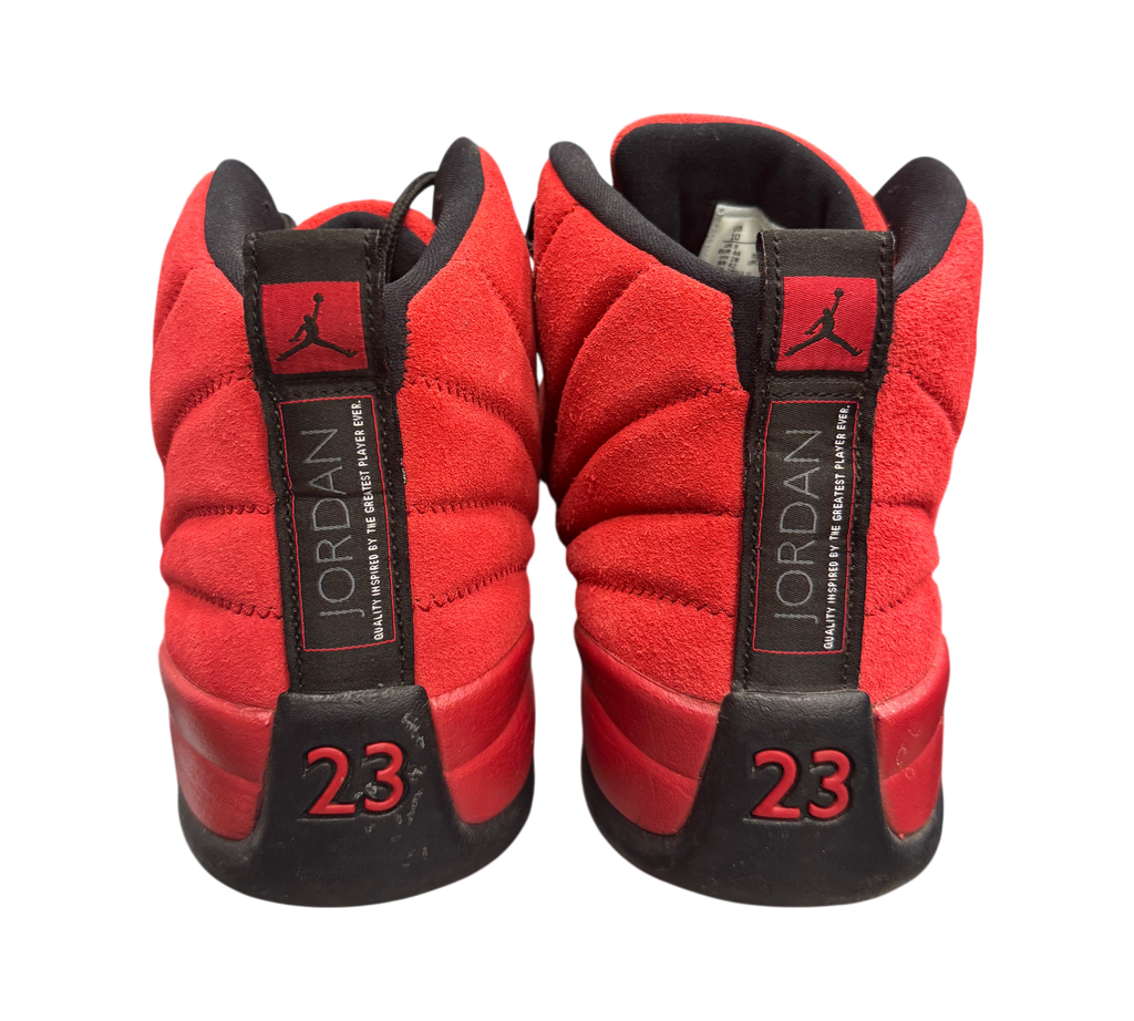 Genesis Boutique used Jordan 12 Reverse Flu Game sneakers in red suede with black accents and 23 heel branding.
