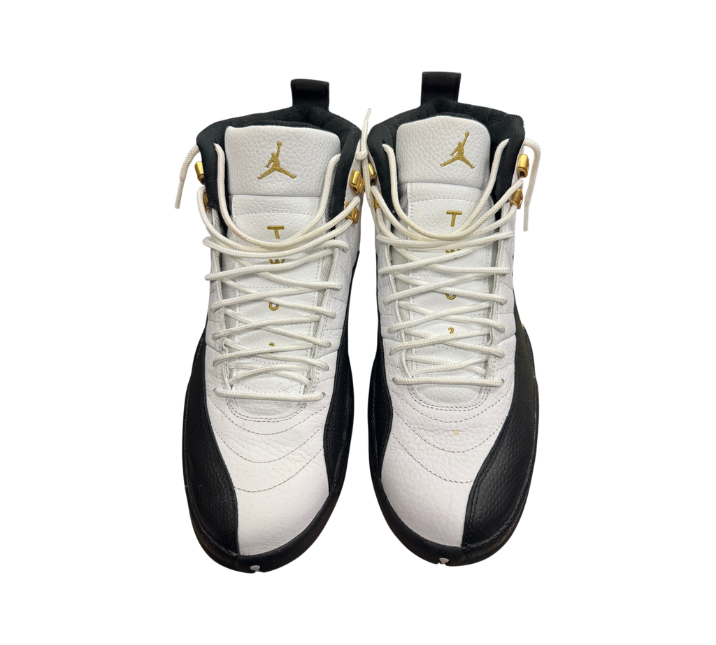 Genesis Boutique Jordan 12 Royalty Taxi sneakers in white and black leather with gold accents and white laces