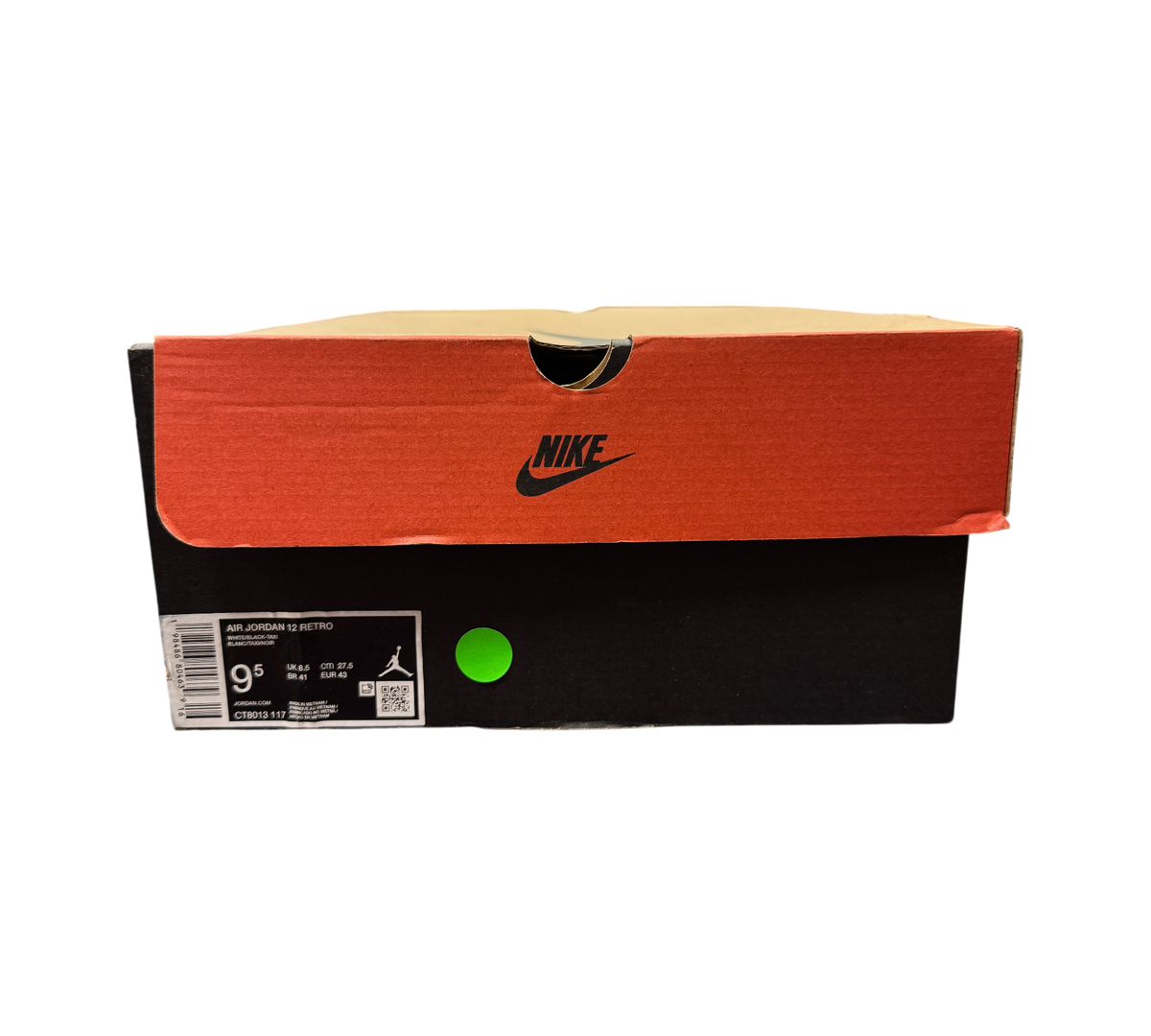 Genesis Boutique Jordan 12 Taxi sneaker box with Nike branding and size 9.5 label in a retail store setting.