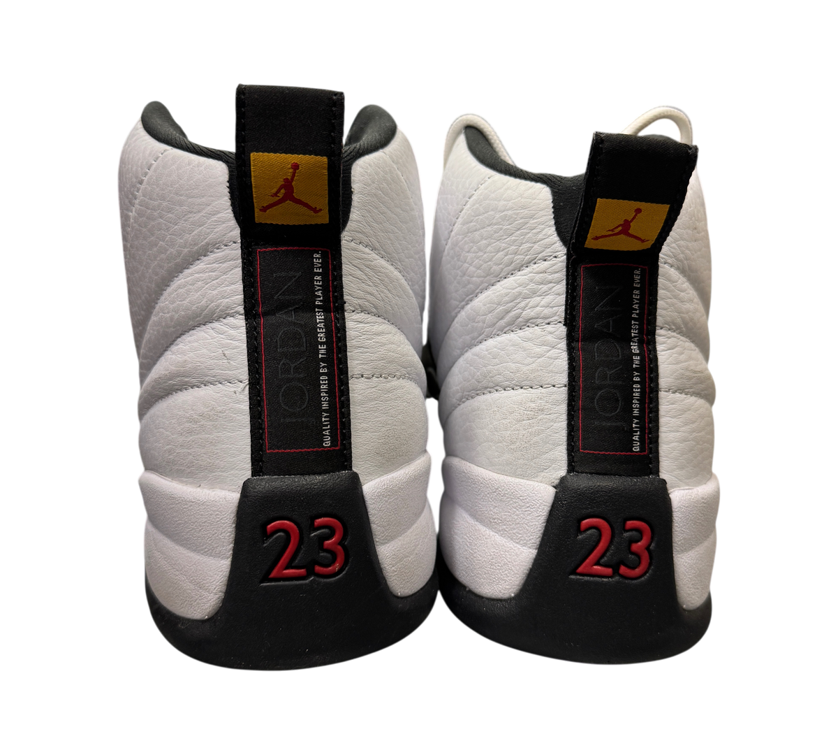 Genesis Boutique pre-owned Jordan 12 Taxi sneakers featuring white leather, black accents, and red 23 heel branding.
