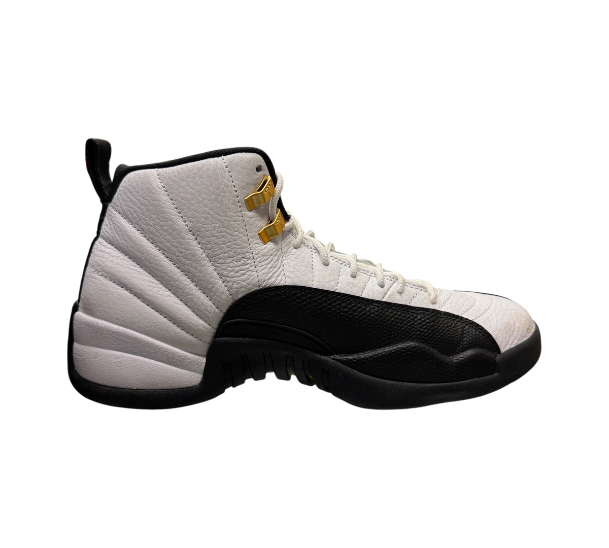 Genesis Boutique pre-owned Jordan 12 Taxi sneakers featuring white leather, black mudguard, and gold eyelet details.