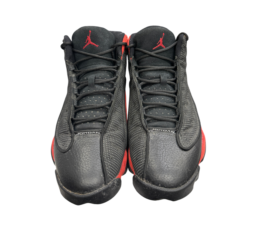 Genesis Boutique pre-owned Jordan 13 Bred sneakers in black and red with signature textured leather and Jumpman logo