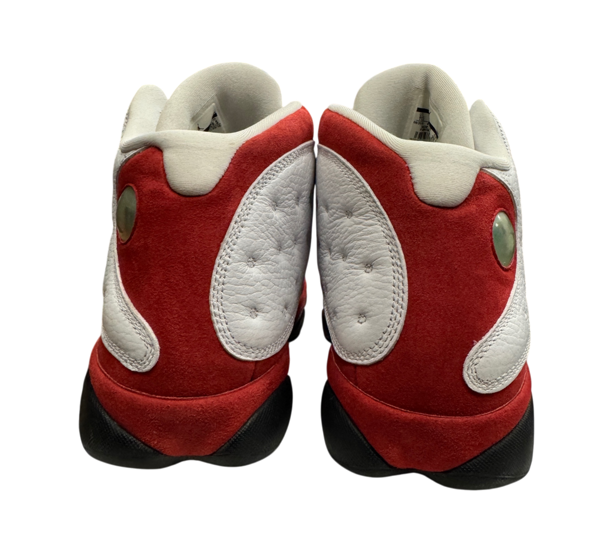 Genesis Boutique Jordan 13 Chicago sneakers in white and red with iconic holographic heel emblem, rear view