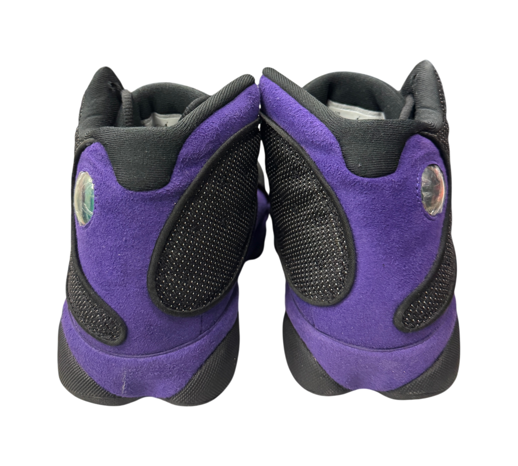 Genesis Boutique Jordan 13 Court Purple sneakers featuring black and purple suede heels with signature hologram logo.